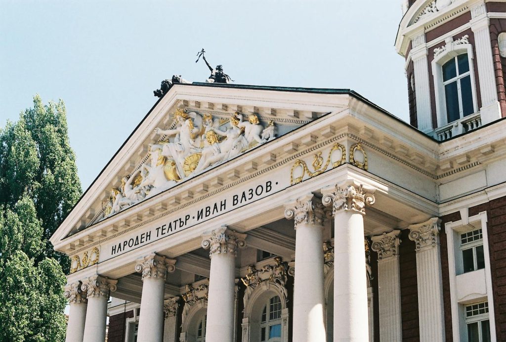 Elegant facade of Ivan Vazov National Theatre in Sofia, Bulgaria showcasing classical architecture.